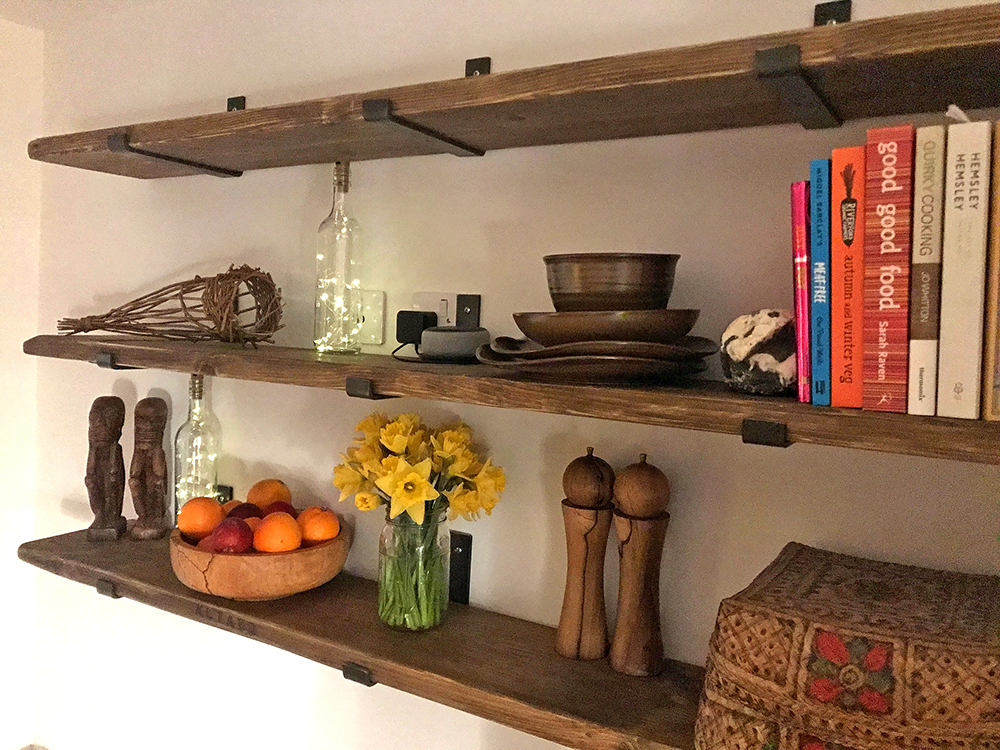 rustic shelving with industrial fixtures